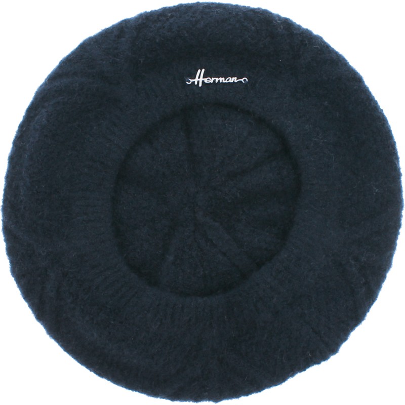 Women's beret in acrylic with a flower design on the top Women's beret in acrylic with a flower design on the top